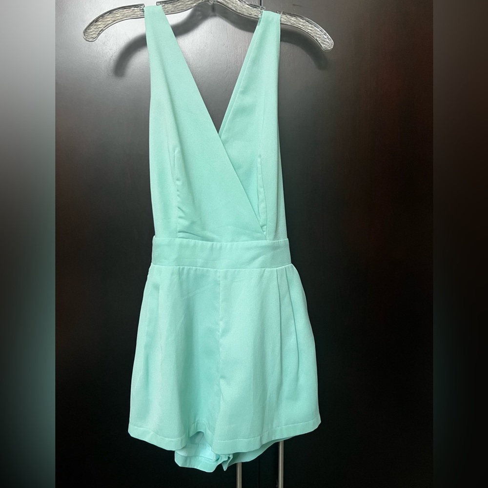 Mint green romper. Has pockets! Racer back with button closure.